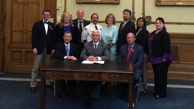 Indiana Governor Mike Pence and others