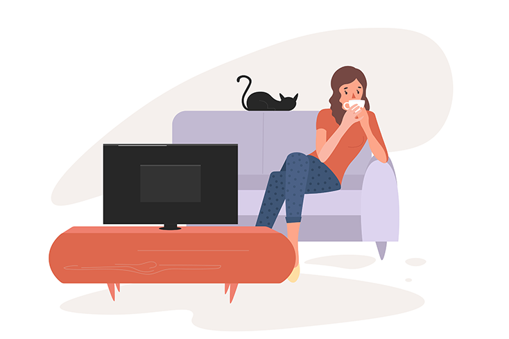 Person relaxing with coffee on couch