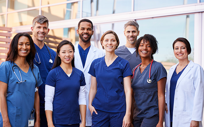 Group of medical professionals in line