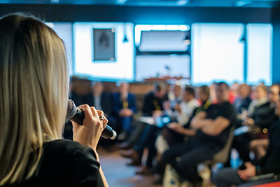 Woman speaking to law enforcement audience